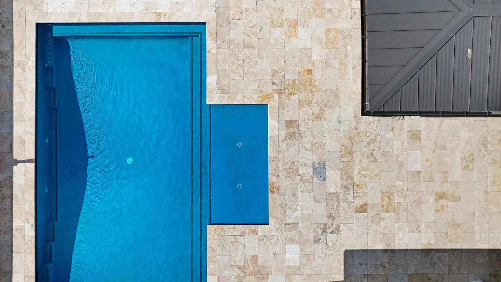 Aerial view of a modern pool and patio