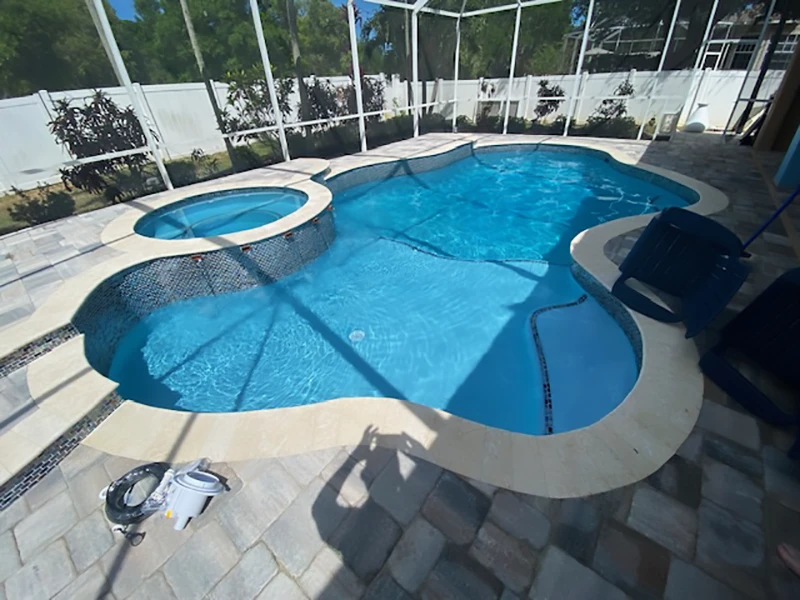 Bright blue pool with spa area
