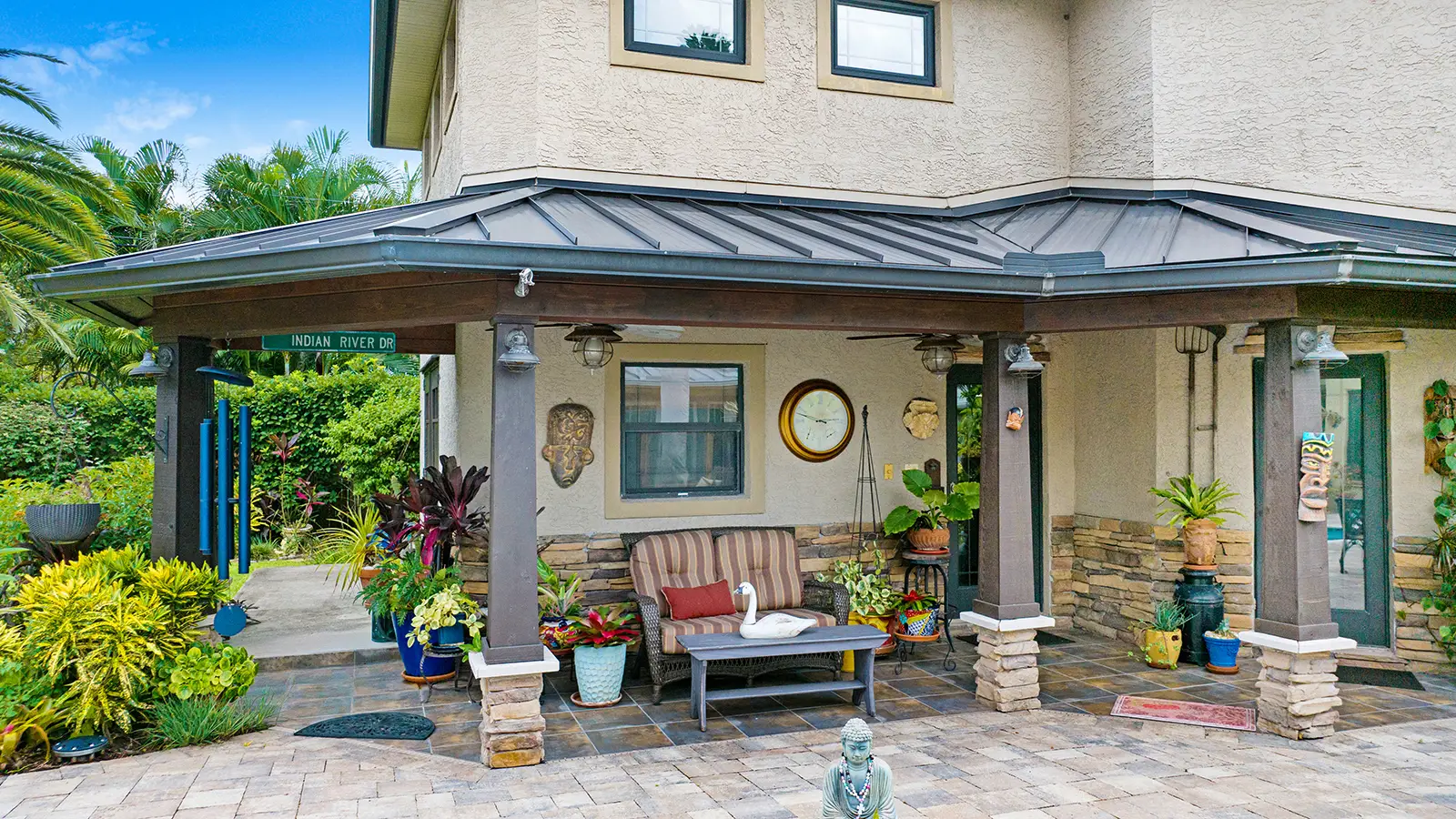 A tropical style home with beautiful patio pavers
