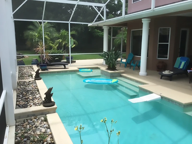 Sunny poolside with lounge chairs