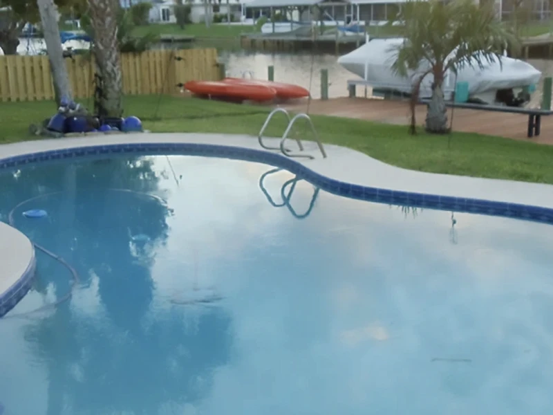 Poolside view with boats nearby