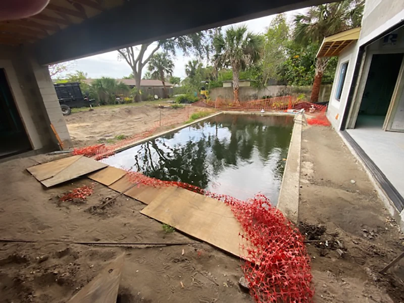 Under-construction pool with safety barriers