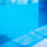 Crystal clear blue swimming pool water