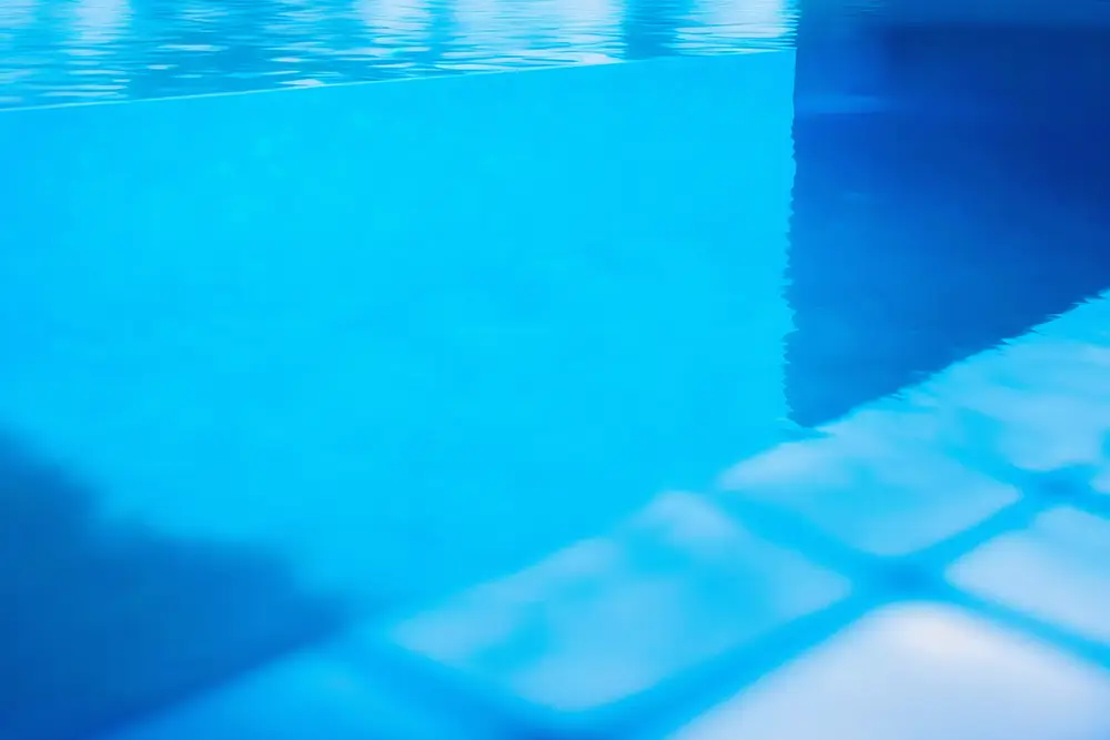 Crystal clear blue swimming pool water