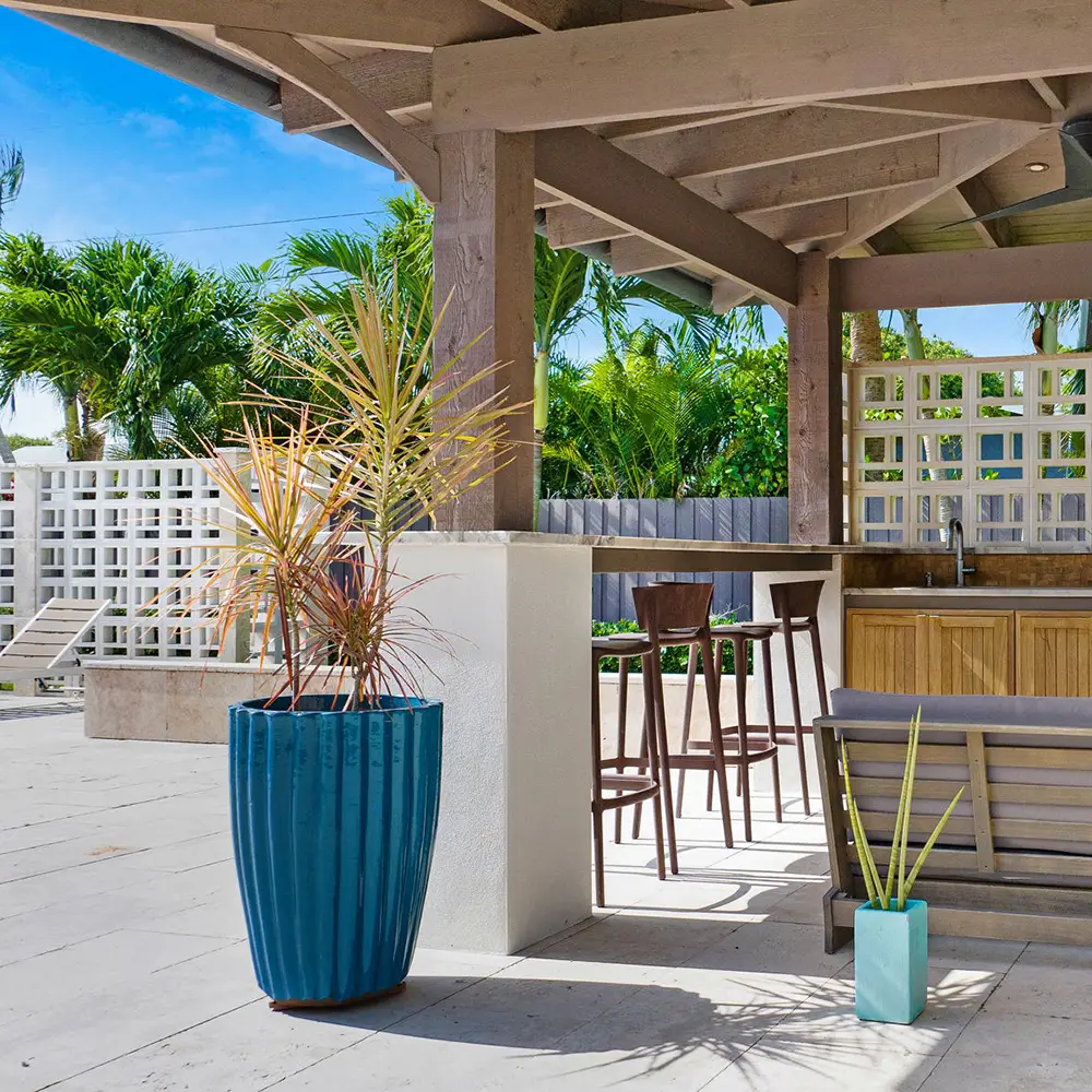 An outdoor kitchen with stone patio pavers