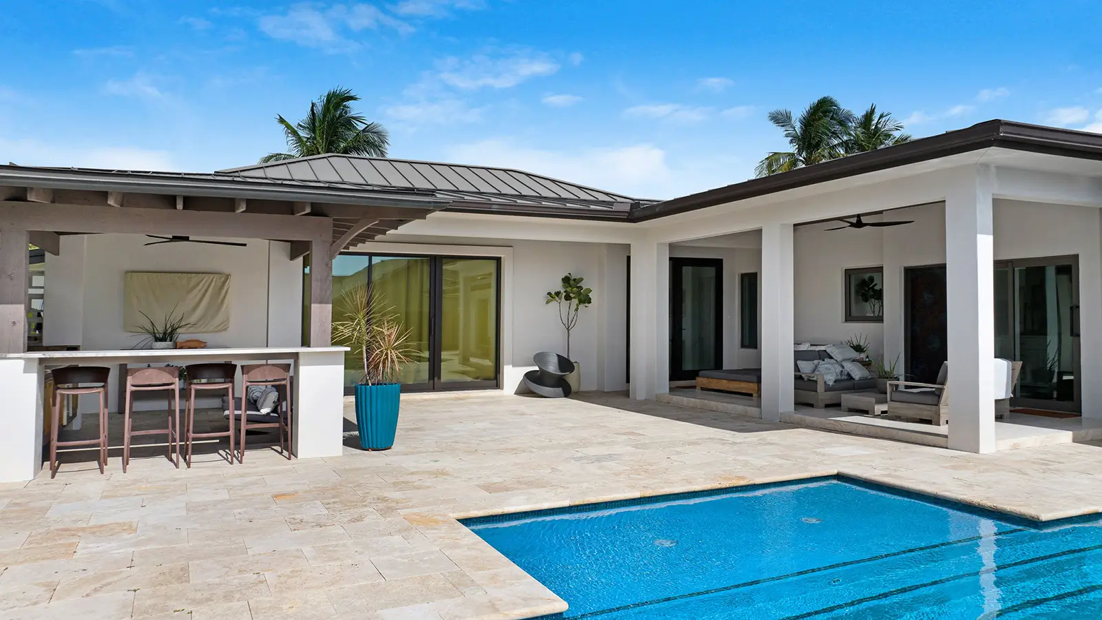 A modern home in Florida with a beautiful patio and pool