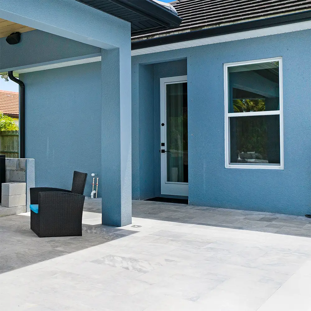 A home's back patio with custom stone pavers