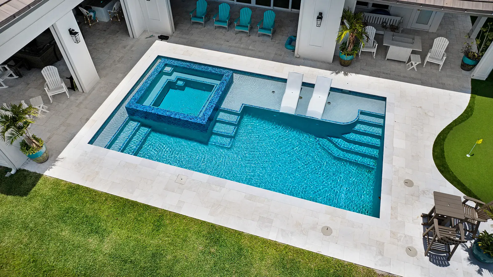 Aerial image of a home swimming pool and putting green