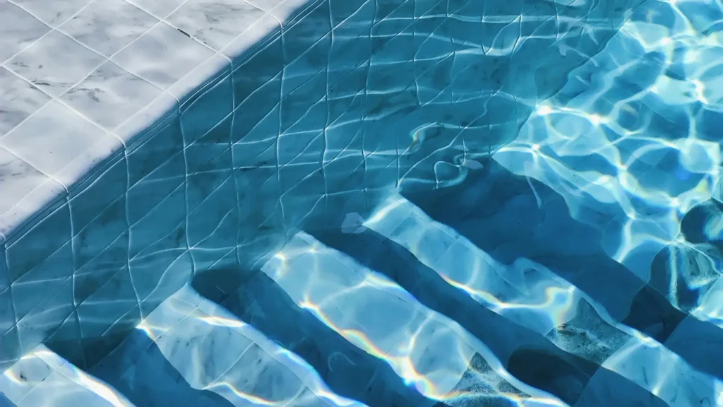 Pool tile and steps with crystal clear water