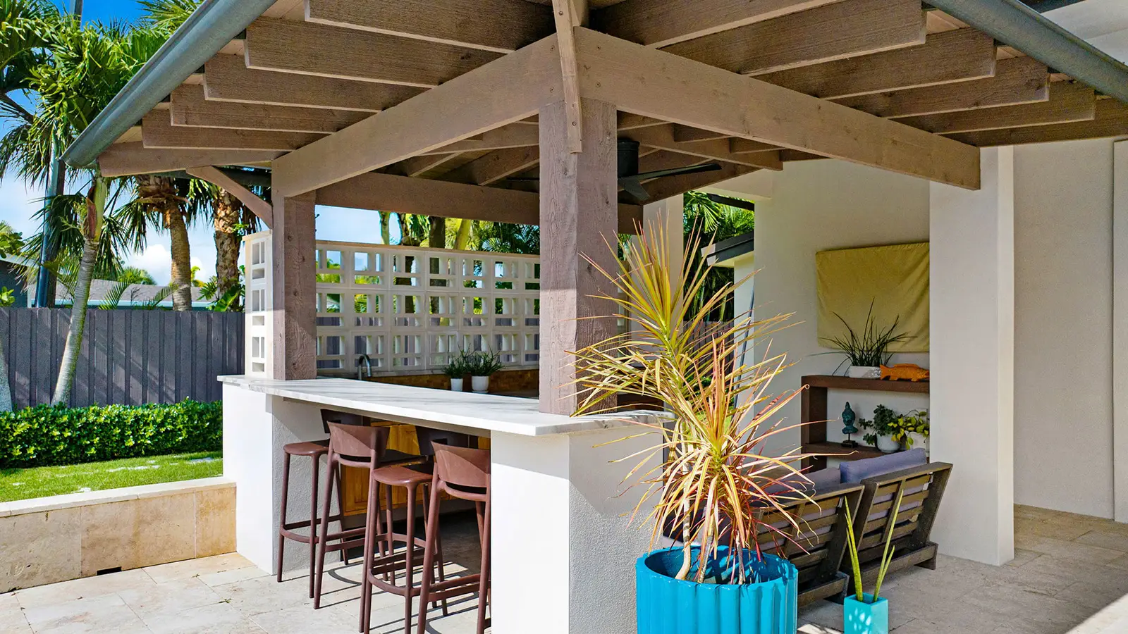 A home back patio with a custom bar and pavers