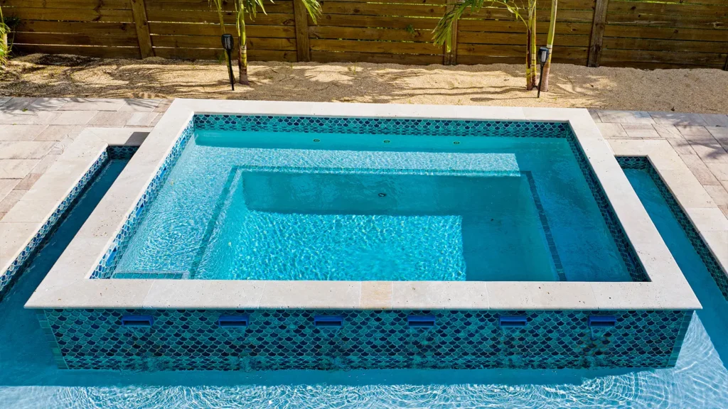 A pool spa with waterfall fountains