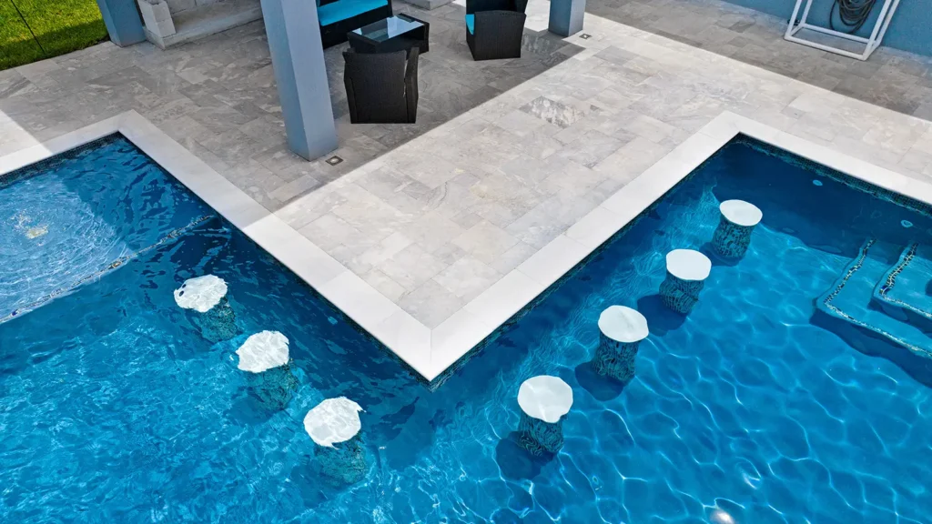 A swimming pool with custom bench seats