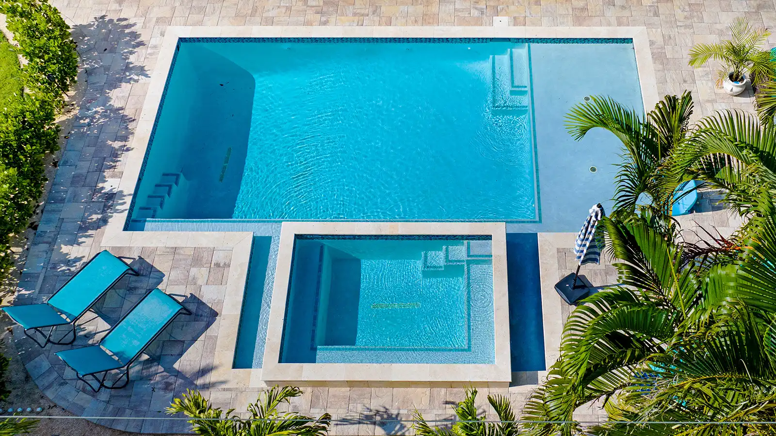 Aerial photo of a swimming pool and backyard patio