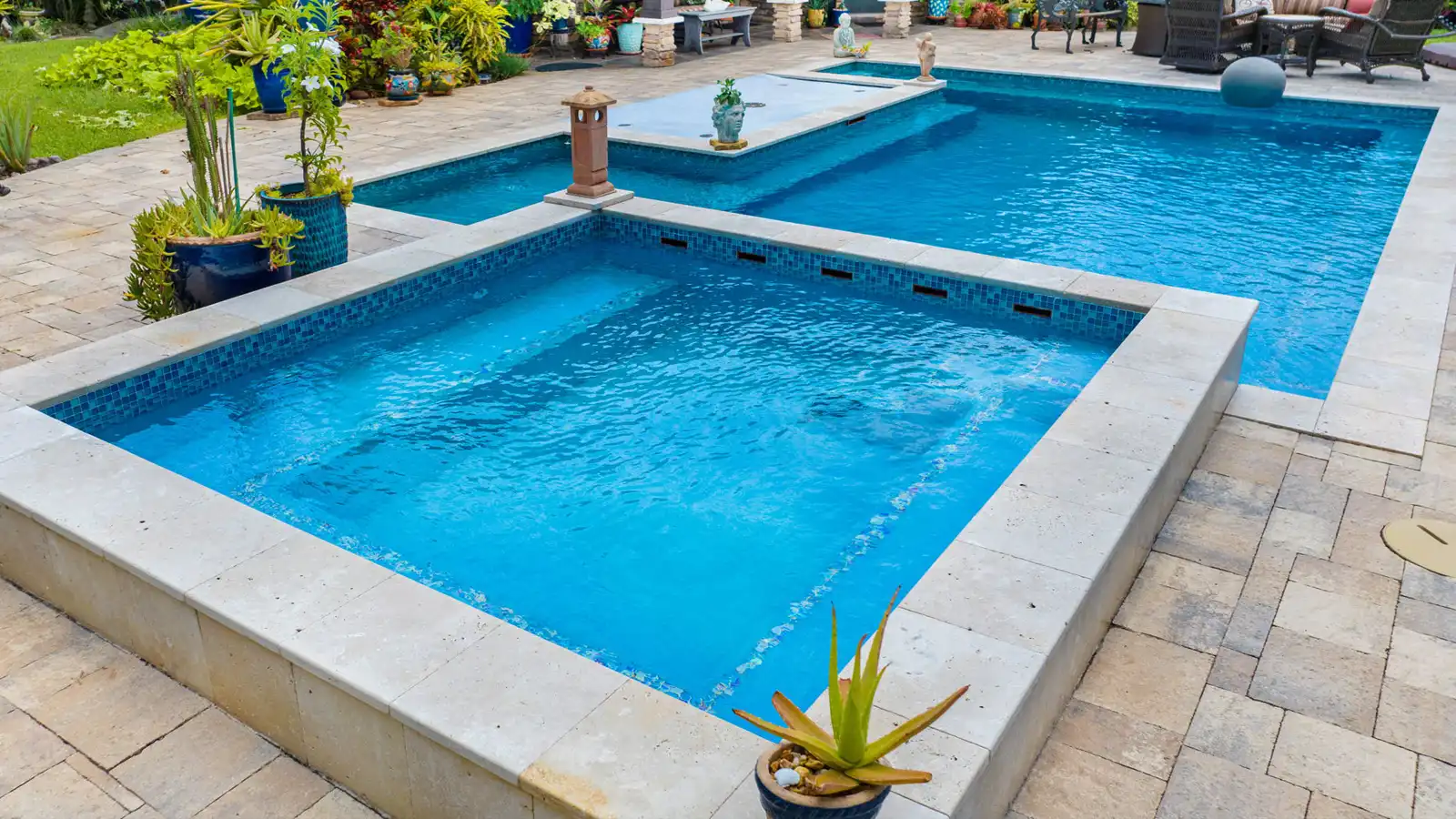 A swimming pool with a built in spa